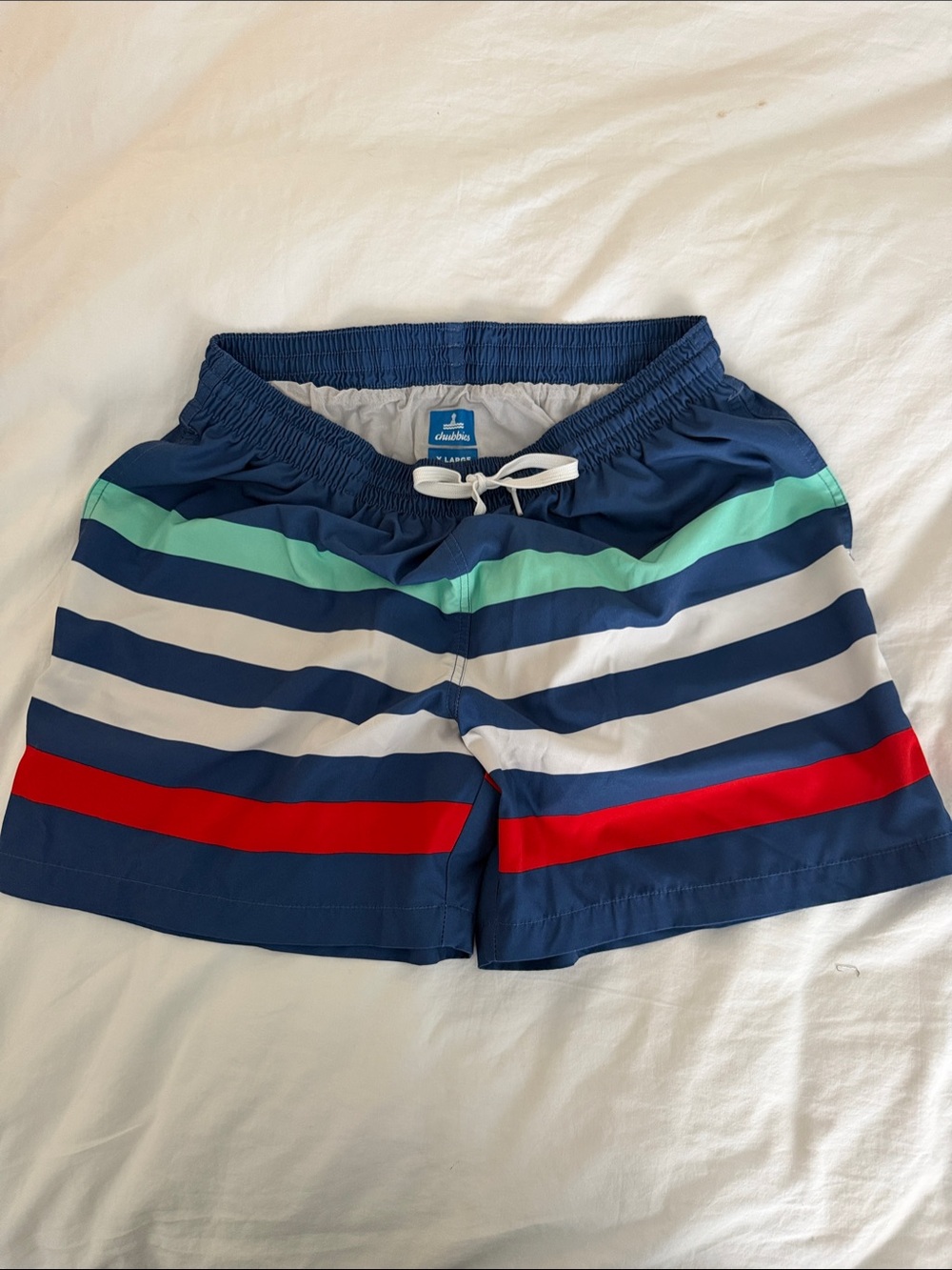 chubbies Navy Swim Trunks with White, Red, and Mint Stripes